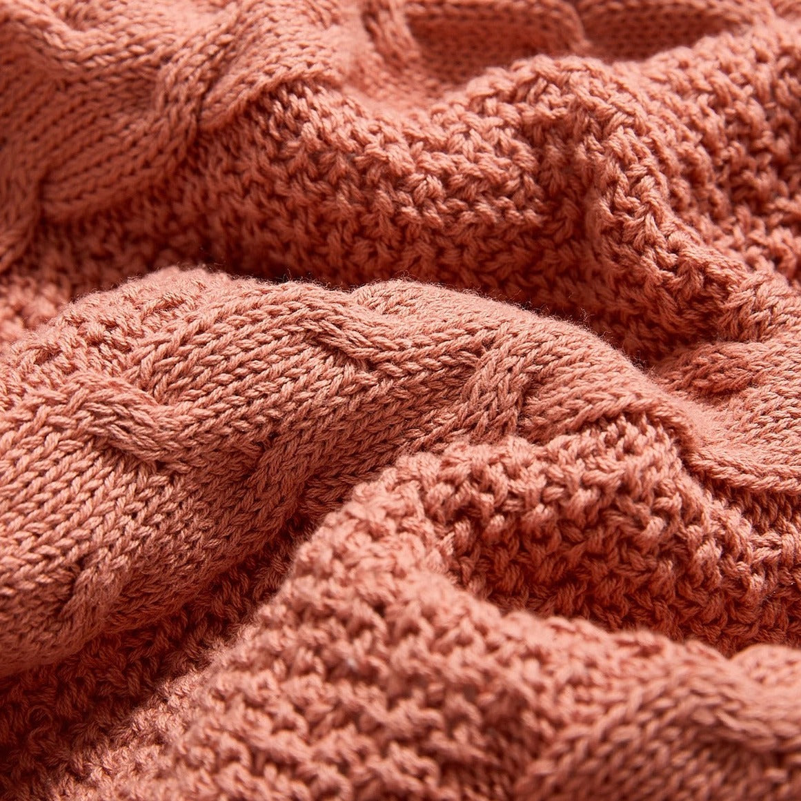 Plaid lit rose à motif relief