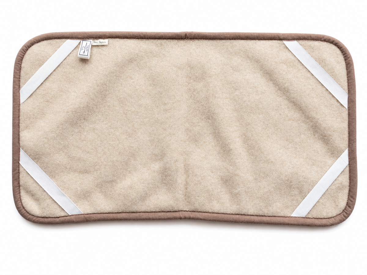 Surmatelas en laine pour berceau et poussette beige, dessous avec les élastiques aux quatre coins